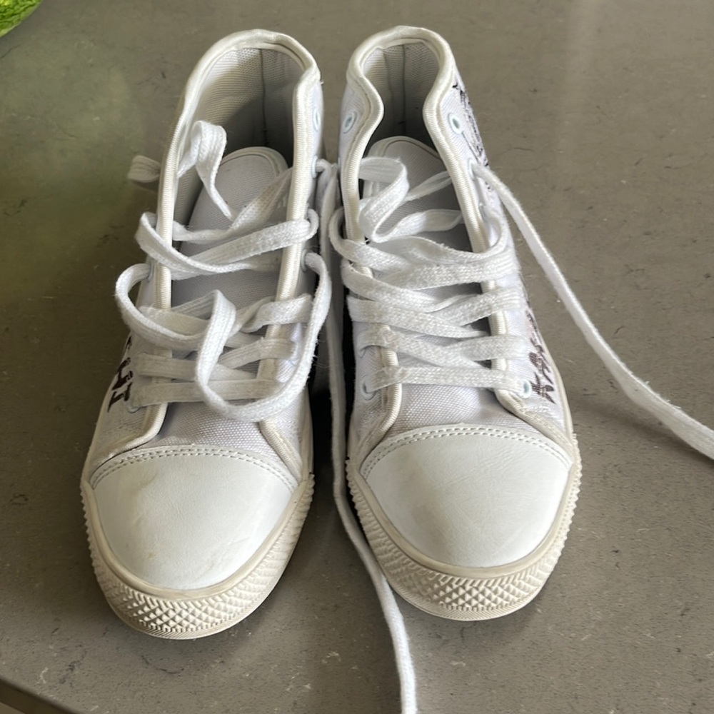 Naruto kakashi high top sneakers. No size on it but fits like a youth 4.